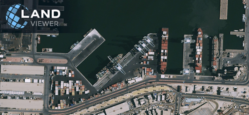 high-resolution satellite view of shipping containers and vessels at a port in Kuwait