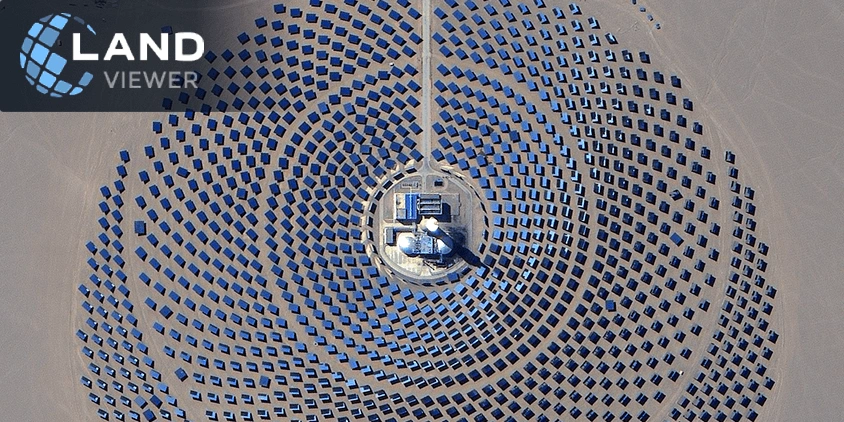 very high-resolution 0.8 m satellite view of a circular solar farm