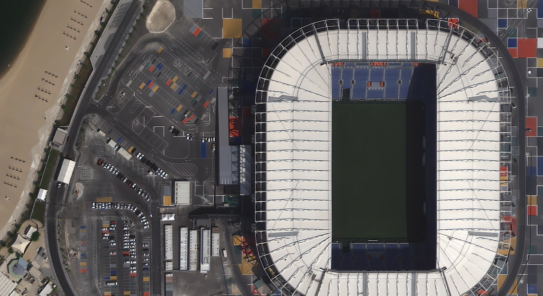 best high-resolution satellite imagery of Al Janoub Stadium for the detailed analysis of the site, parking occupancy, and nearby infrasturcture
