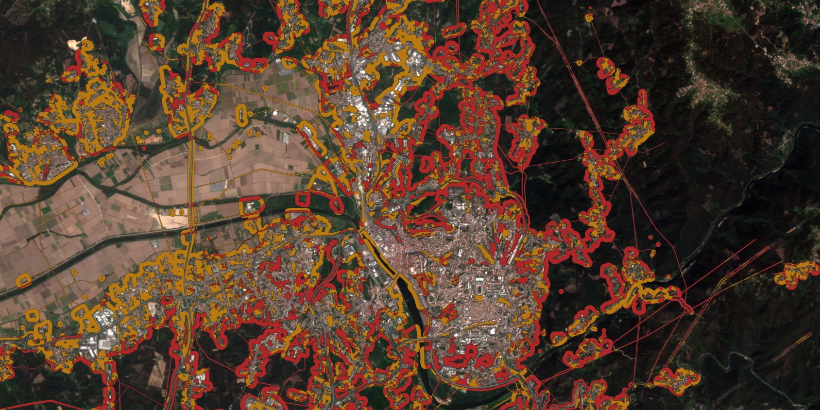 uma máscara de risco de incêndio sobre Coimbra com áreas de alto risco em vermelho e de baixo risco em amarelo ao longo da infraestrutura